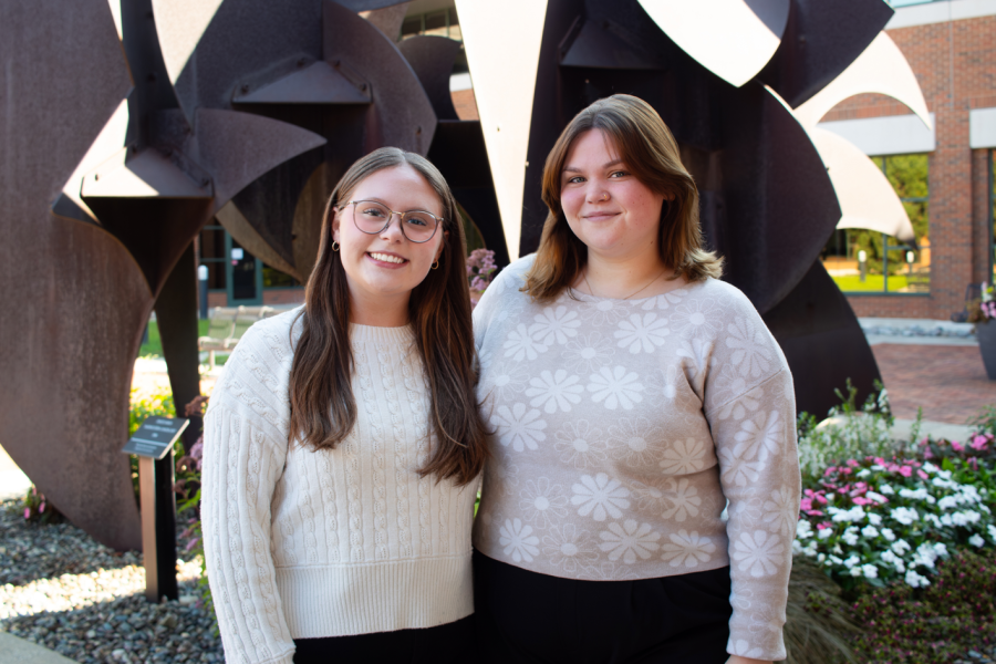 Photo of Sarah Cook and Lyndsey Sootsman outside of schneider hall