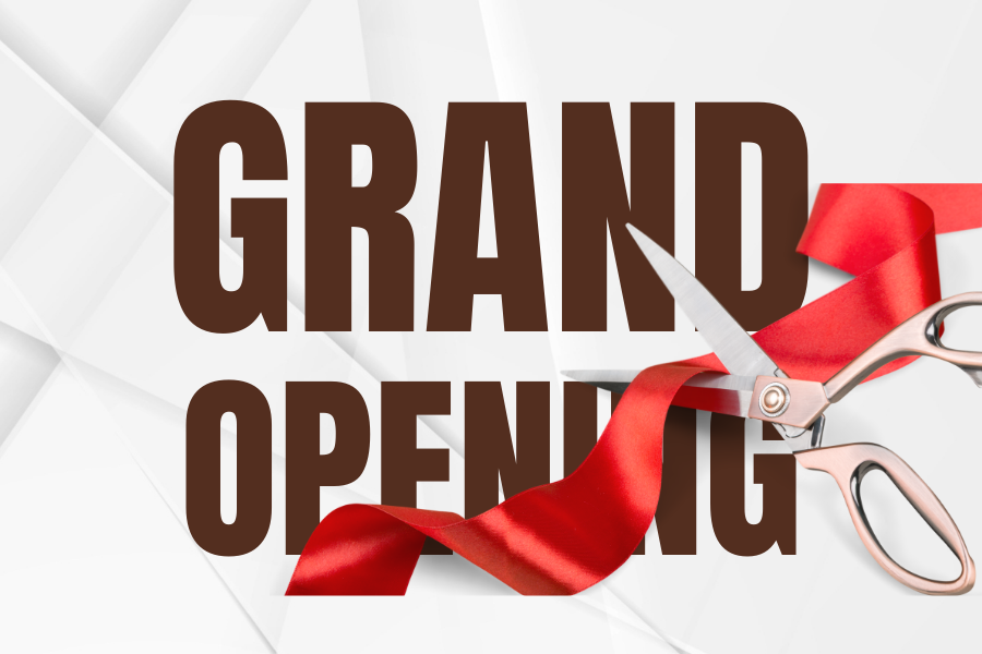 Image of scissors cutting a ribbon