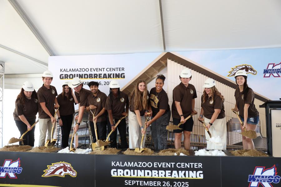 The Lawson Lunatics toss ceremonial shovels of dirt.