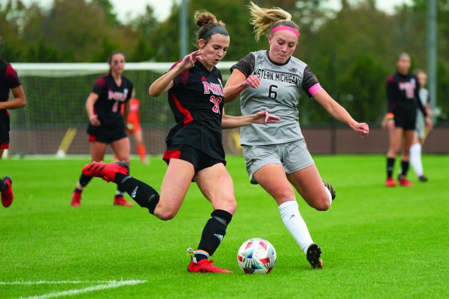 A Western Michigan women's soccer athlete with the ball on the field.