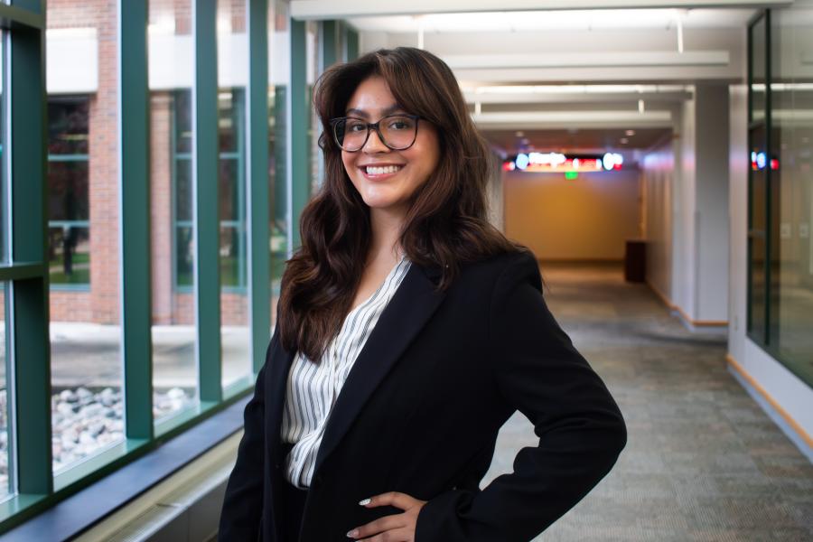 Karen Xospa standing next to wall in Haworth College of Business