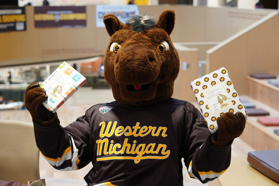 buster bronco holding books