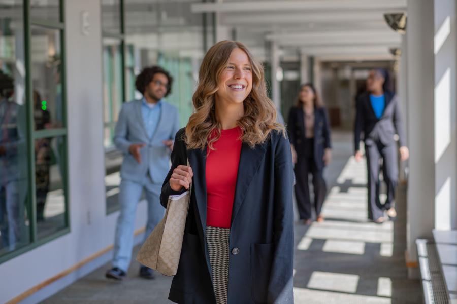 A woman walking through the hallway 