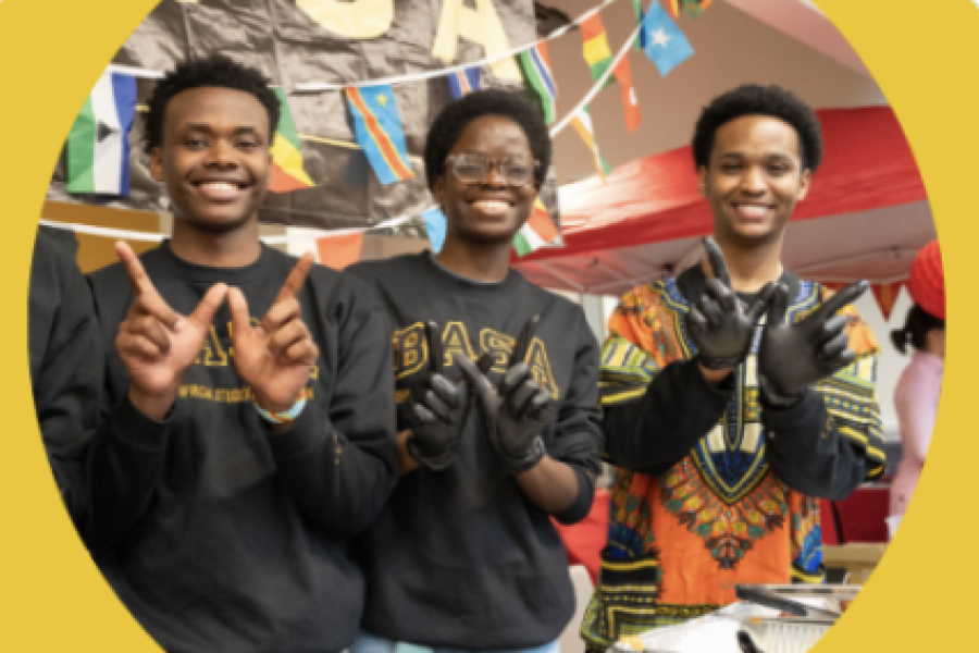 Happy kids with W hands