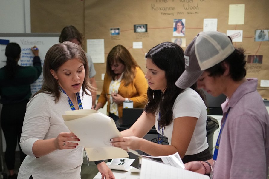 Students from WMU's Cold Case Program work on a case.