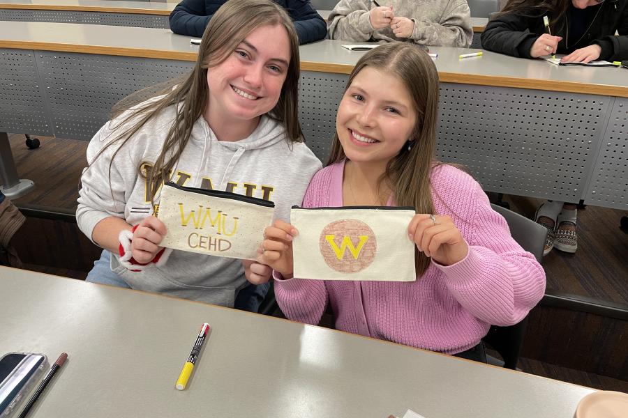 students holding care packages for teachers