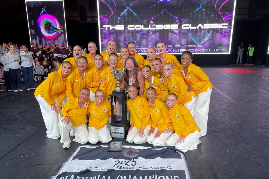 WMU dancers pose with a statue.