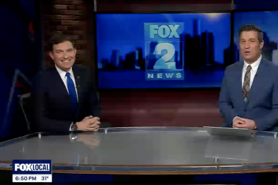 President Kavalhuna sits on an anchor desk.