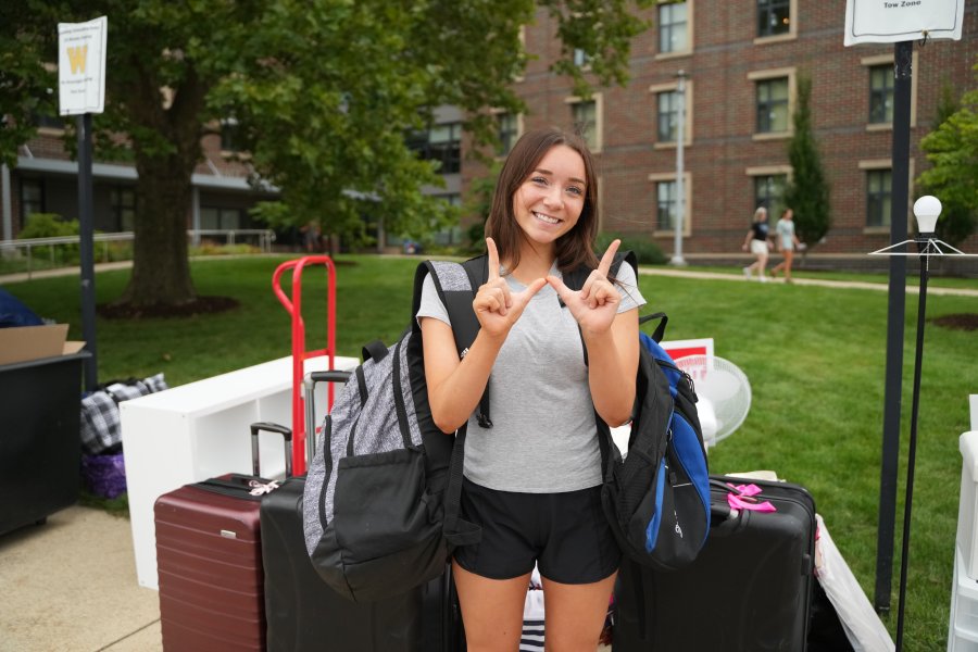 student moving in to a residence hall