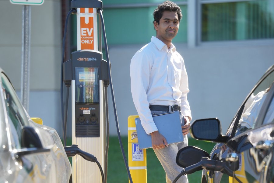 Dr. Shameek Bhattacharjee stands near Floyd Hall's EV charging station 