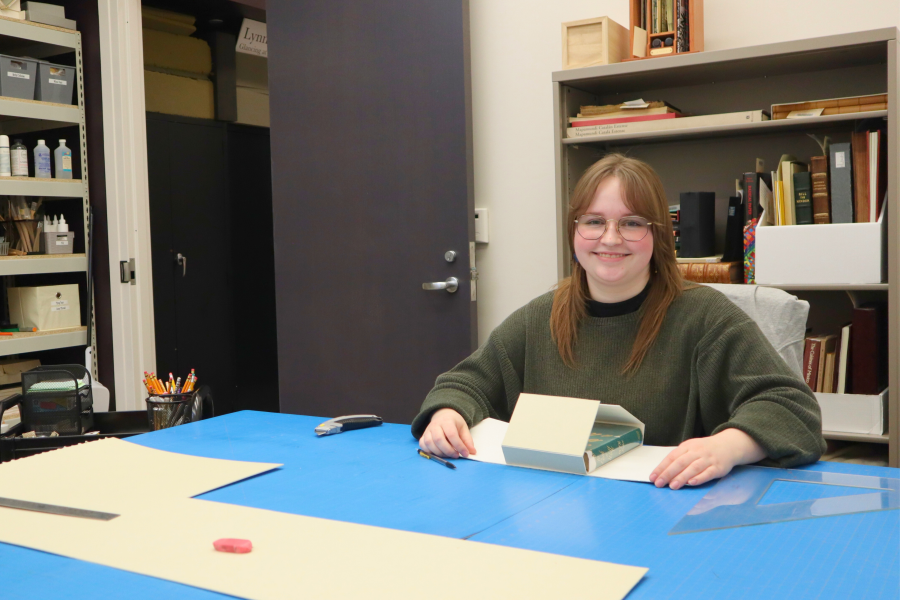 User sitting in preservation room at Zhang Legacy Collections Center.