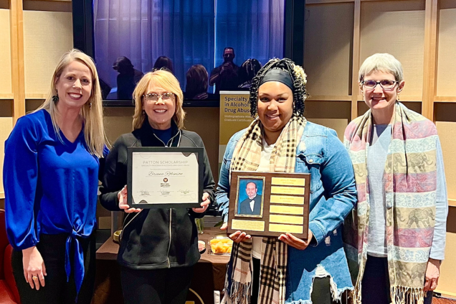 Female student receiving scholarship from the Dean