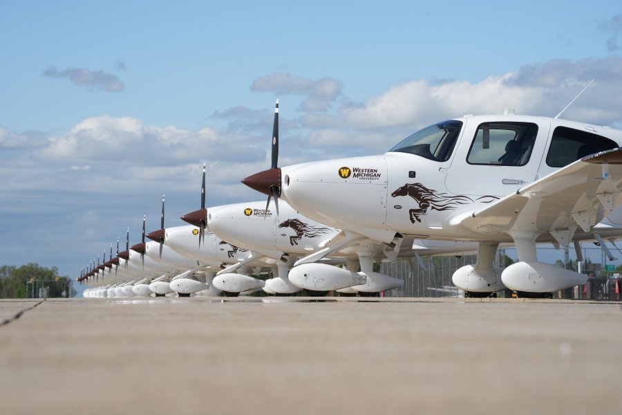 A row of multiple WMU aircraft on the tarmac at the College of Aviation.