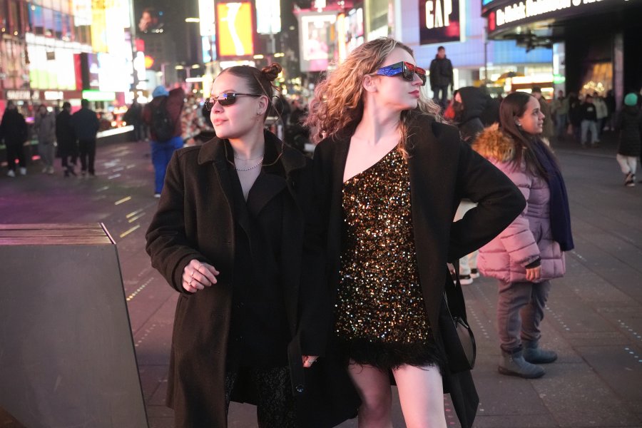WMU students Genesis Fernandez and Ainsley Rahm strutting down the streets of New York's Times Square.
