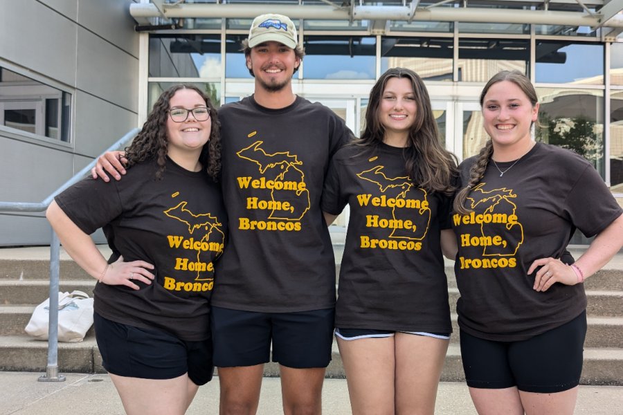 Group of students in front of library.