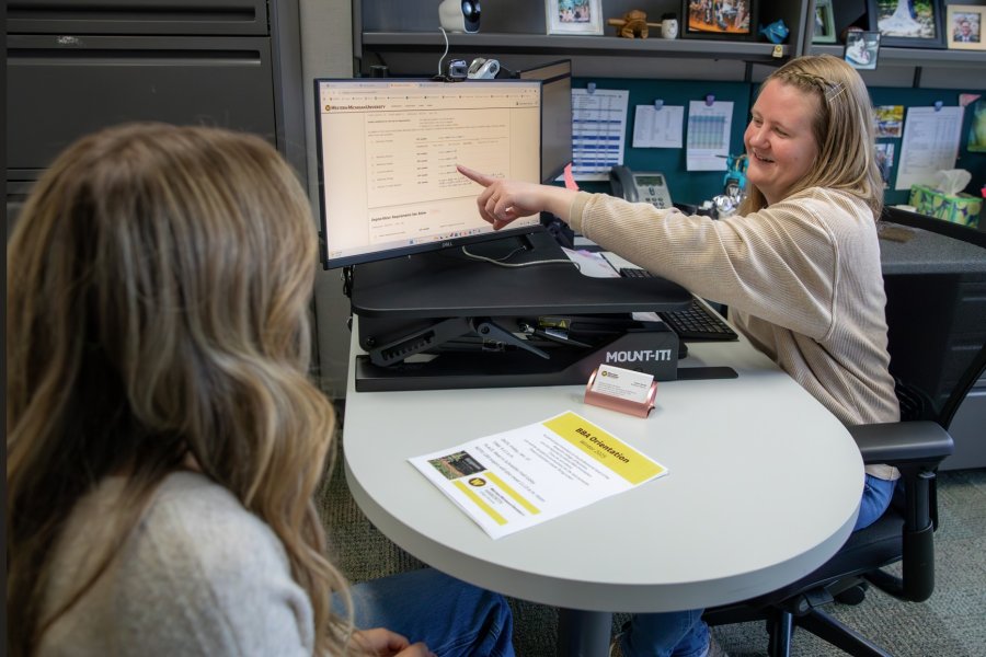 student meeting with advisor in advisor's office