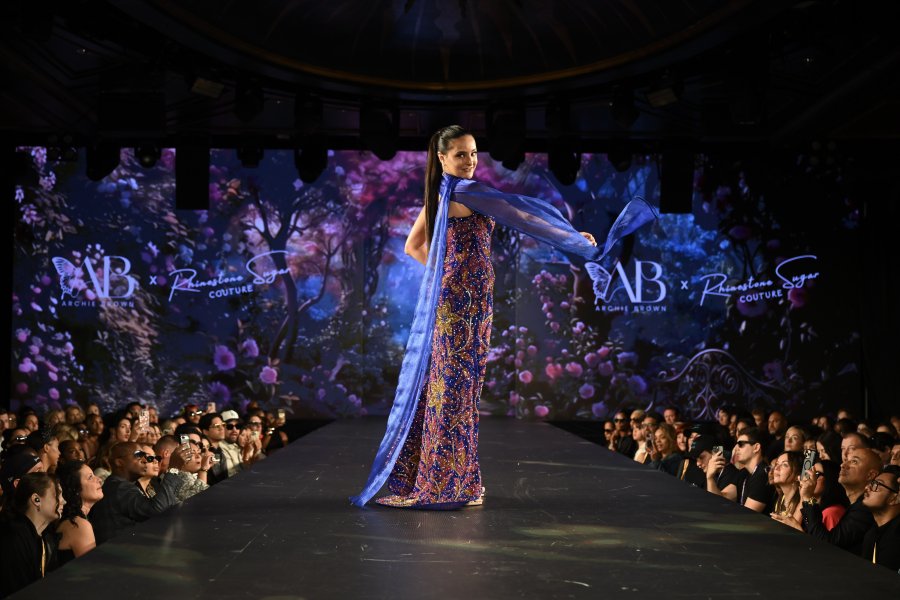 Maya Narayan models a bedazzled gown on a New York Fashion Week runway.