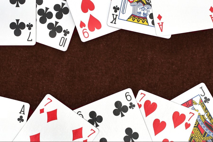 Deck of cards fanned out on the WMU background color.