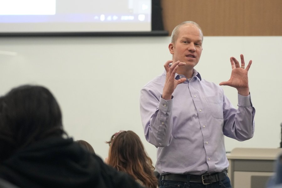 Dr. Gogan in class demonstrating knowledge