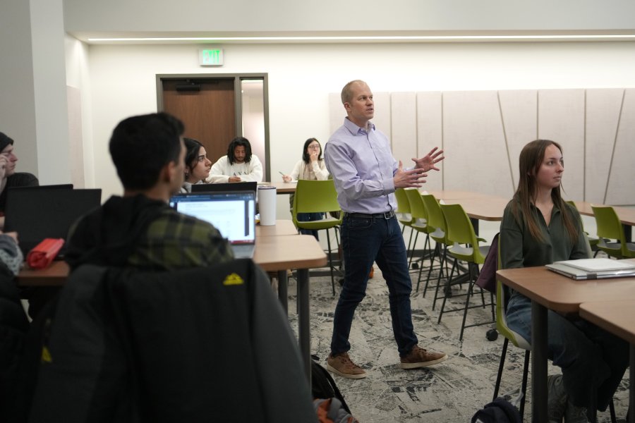 Dr. Gogan in Dunbar Hall classroom, teaching