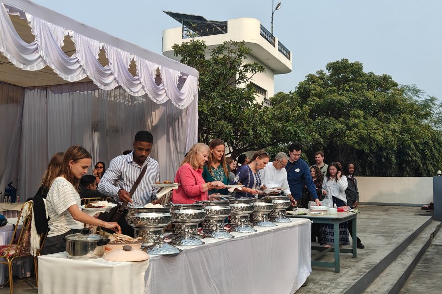 WMU students participating in an outdoor meal in India