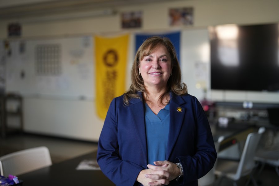 A portrait of Dr. Ashlyn Kuersten in the Cold Case Program classroom.