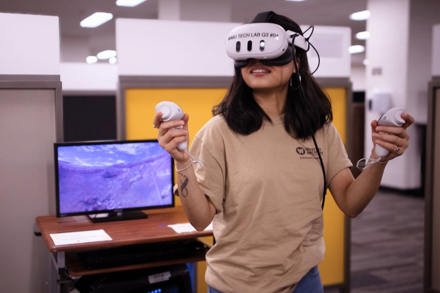 A student wearing a VR headset during a geoscience course that combined 3D printing and virtual reality to help students learn about topography.