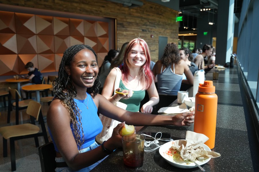 Two students eating at a counter in the Valley Dining Center.