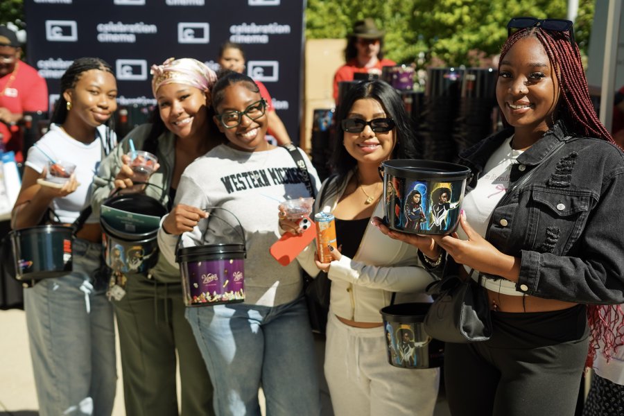 WMU students showing off their popcorn buckets at Bronco Bash