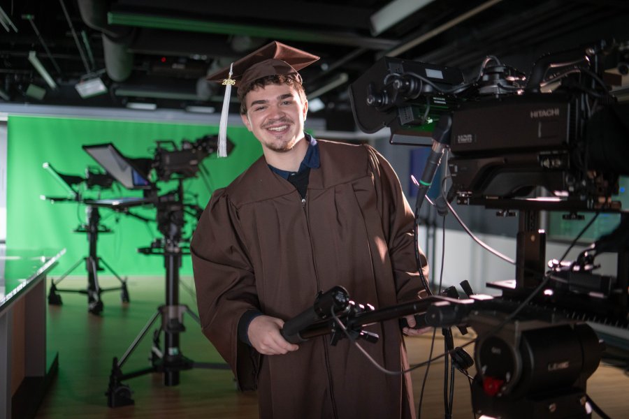 Aidan Ralko operates a studio camera.