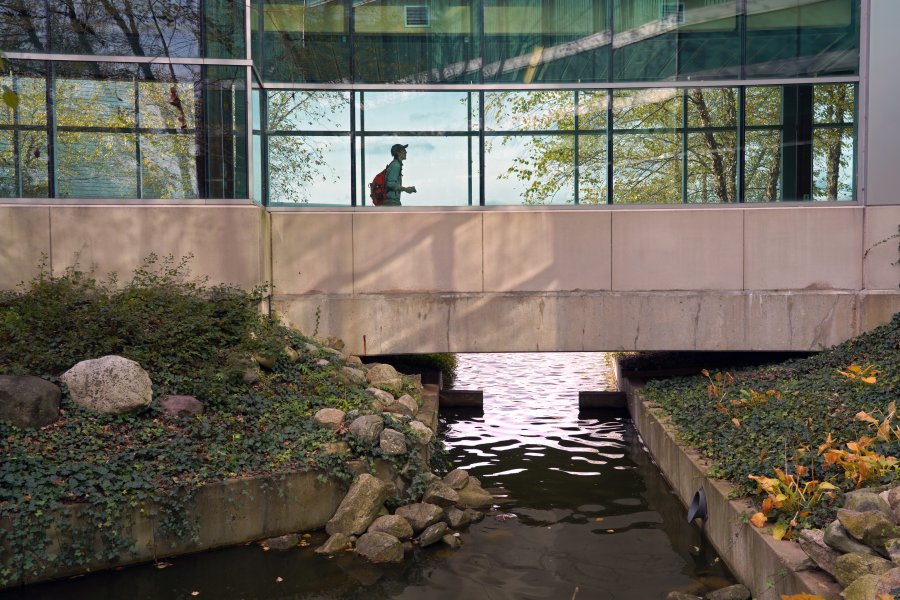 A student walking through a hallway at Floyd Hall. 