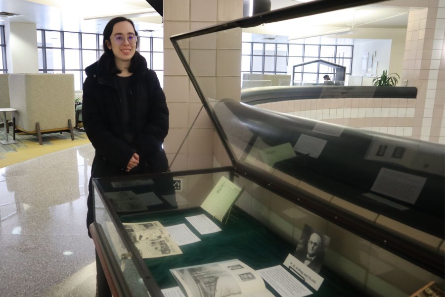Western Michigan University student Meena Jacobs working on exhibit case about W. K. Kellogg and health. 