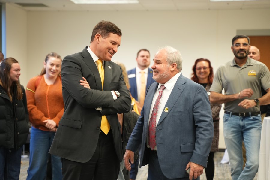 President Kavalhuna speaks with Dan Grady at gift announcement at WMU Haworth