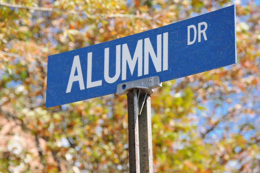 street sign that reads alumni drive.