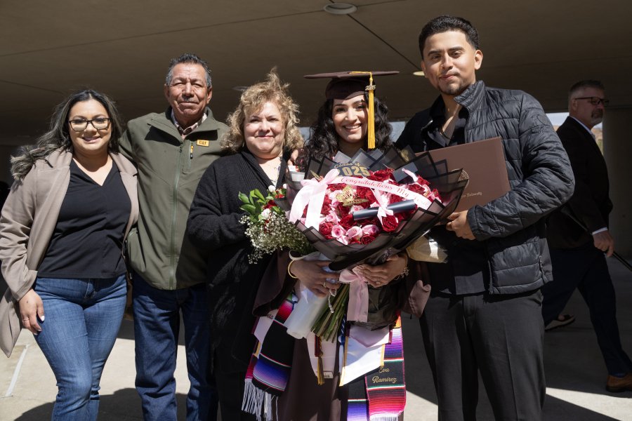 A family posing together at WMU graduation. 