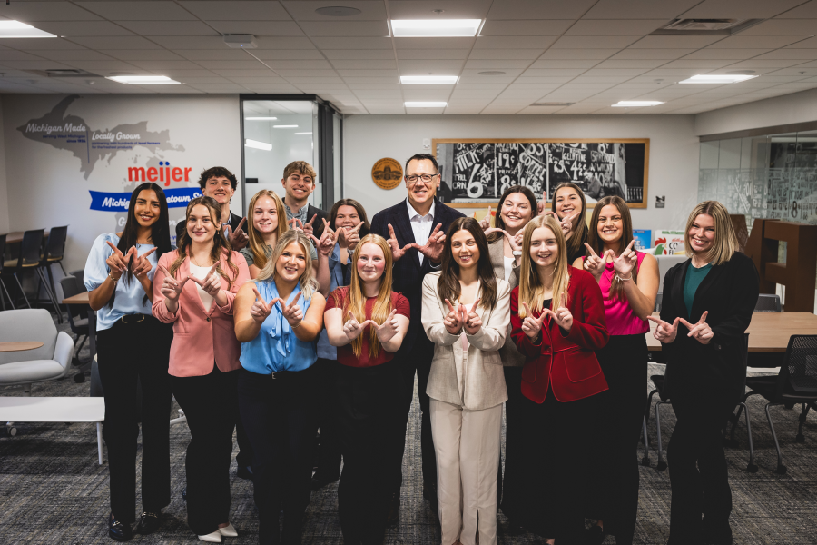 Food marketing students stand with Russell Zwanka in the food marketing hub