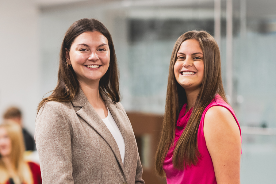 Two food marketing students standing, a PNG of the cover of the magazine