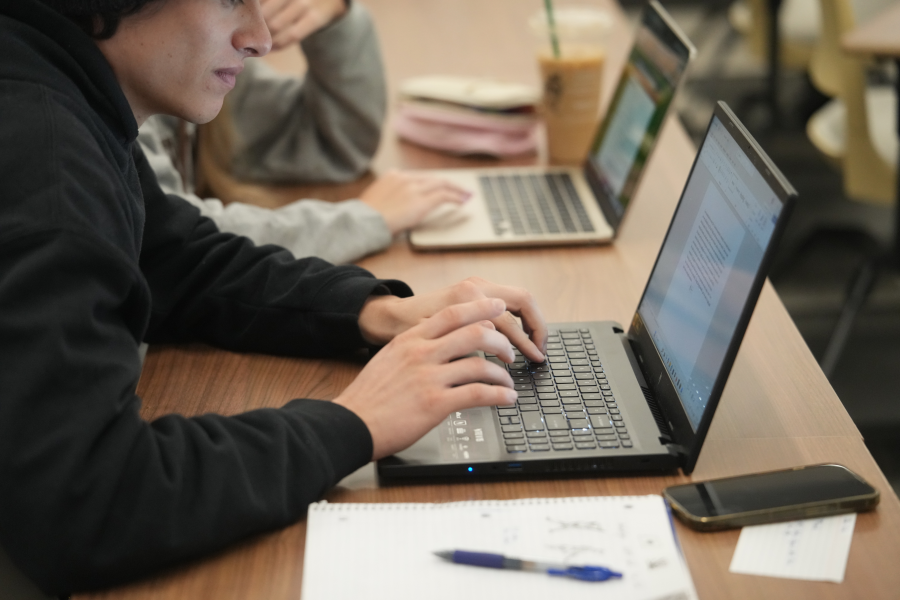 Students working on laptops in an ENGL 1050 class.