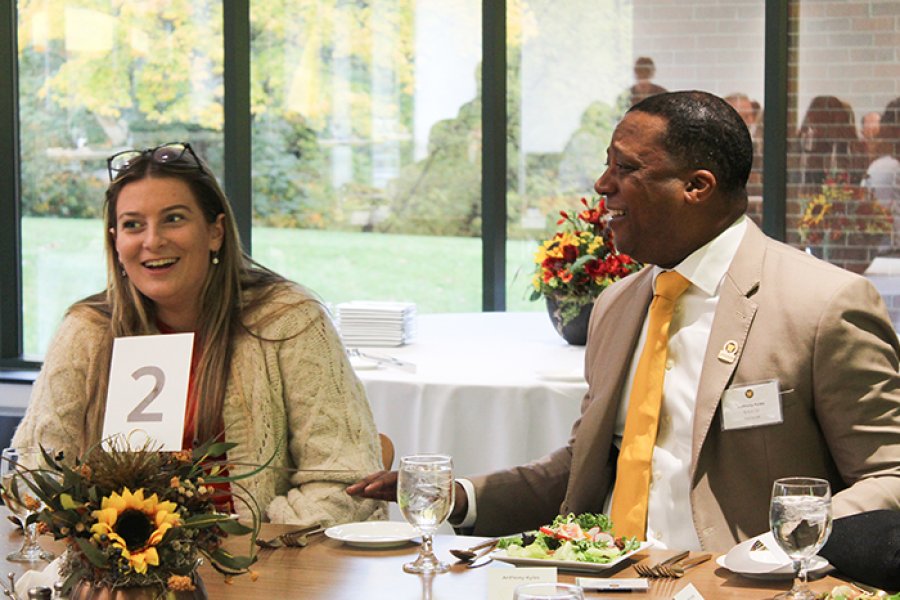 Alum and student networking during lunch