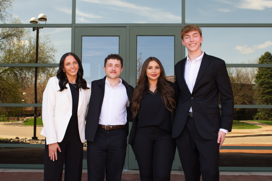 Winning digital marketing team outside Schneider Hall