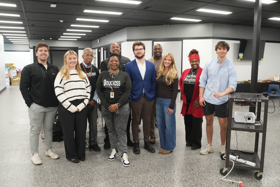 WMU Haworth students and Douglas Community Association staff gather following a final project presentation in spring 2026.