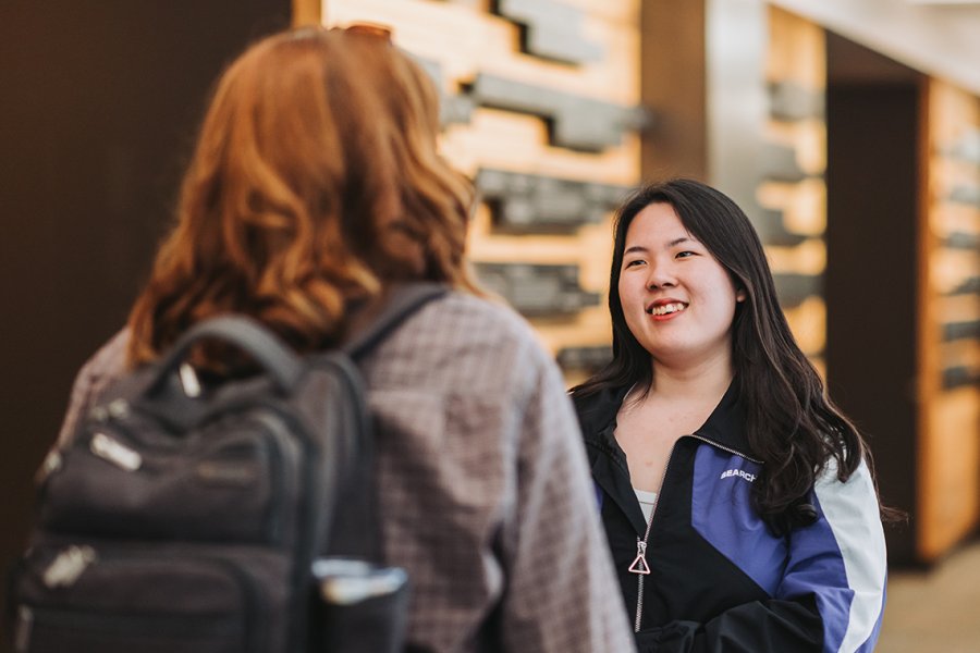 A student conversing with another