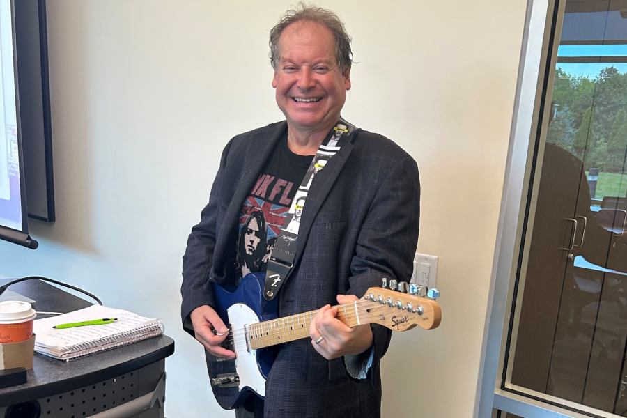 Dr. Feffer holding his guitar