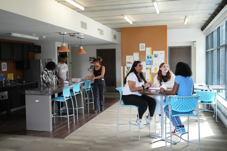 Students hang out in a shared space in Western Heights residence hall.