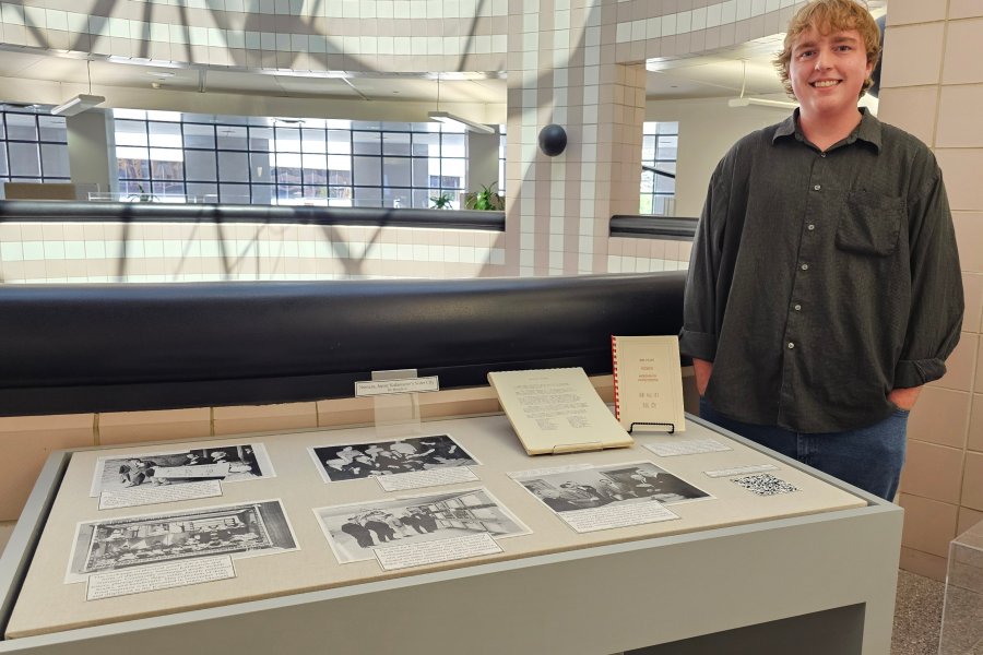 Western Michigan University student Bo Boughton working on exhibit case about Numazu, Japan: Kalamazoo's Sister City.
