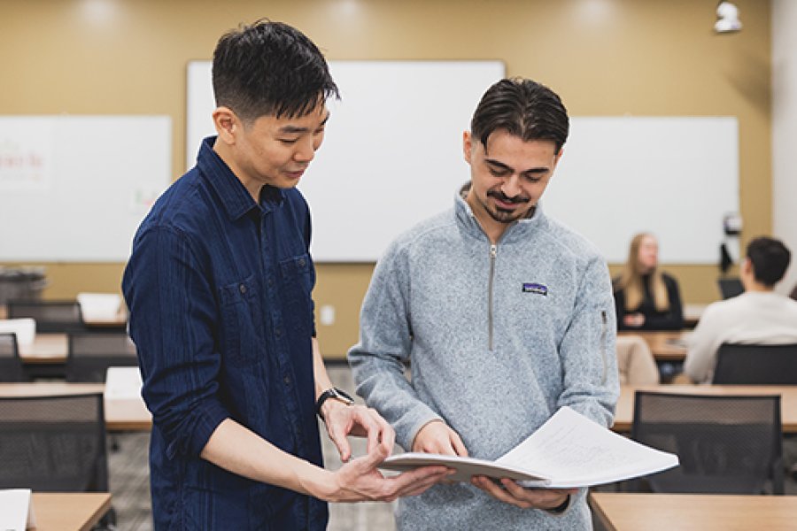 A student and professor studying