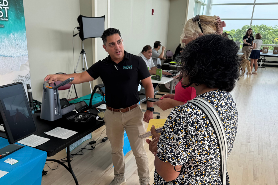 Vision fair participants learn from an expert