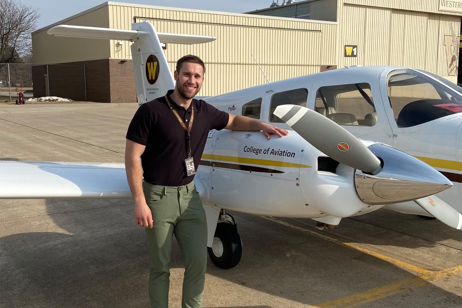 WMU Aviation Alumni Joe Zynda in front of a WMU Piper Seminole