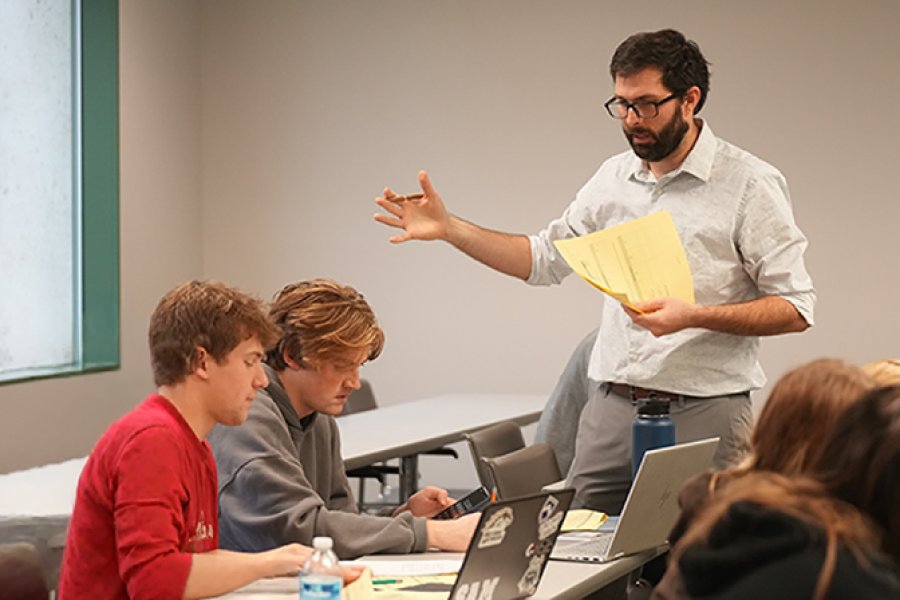 A professor talking to the students