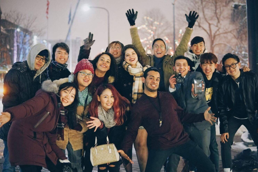 International students from 2016 enjoy a Michigan snow fall.